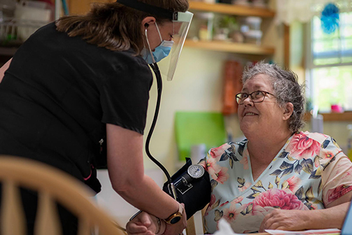 A VNH nurse visiting a patient