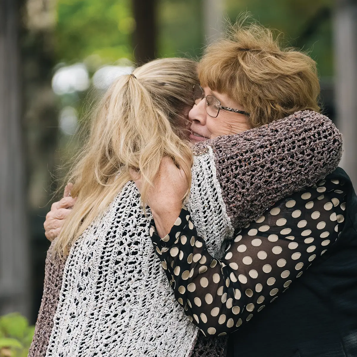 Two women hug eachother