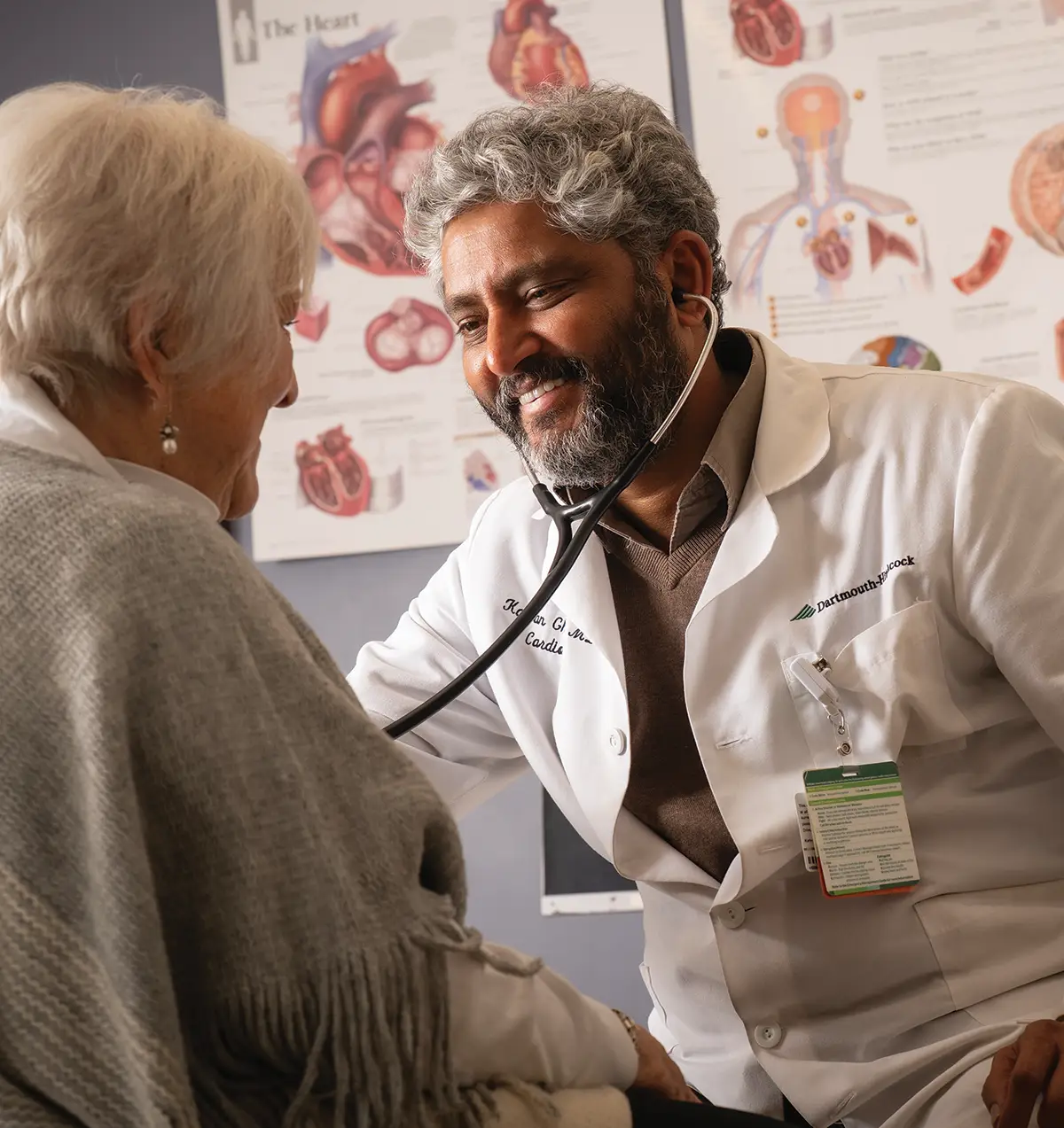 A male doctor treats a female patient