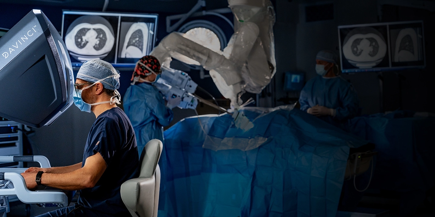 Healthcare provider performing surgery with the DaVinci robotic system