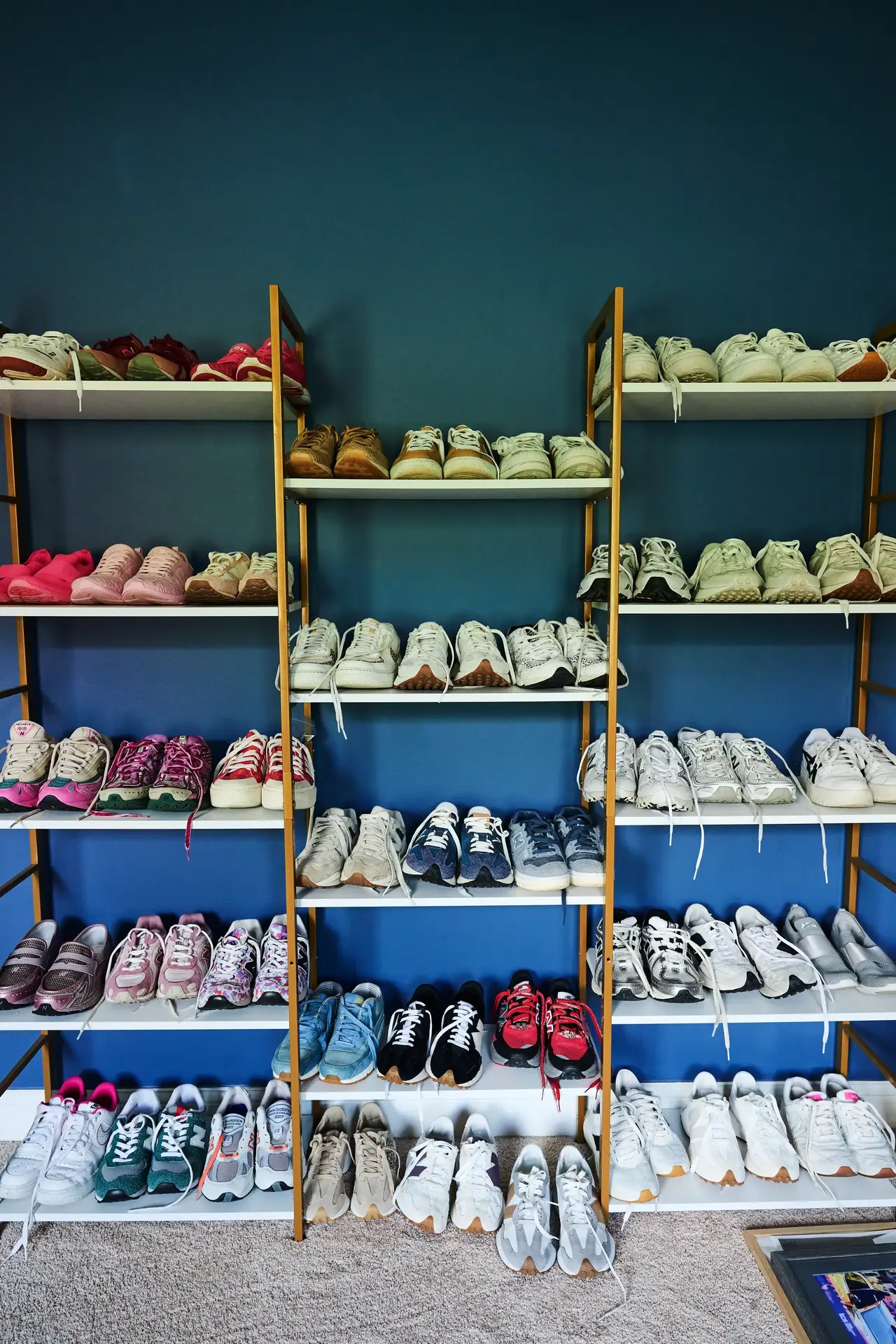 three racks of athletic shoes