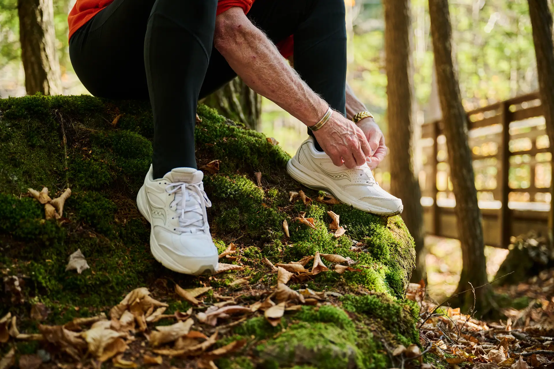 A man tying his shoes