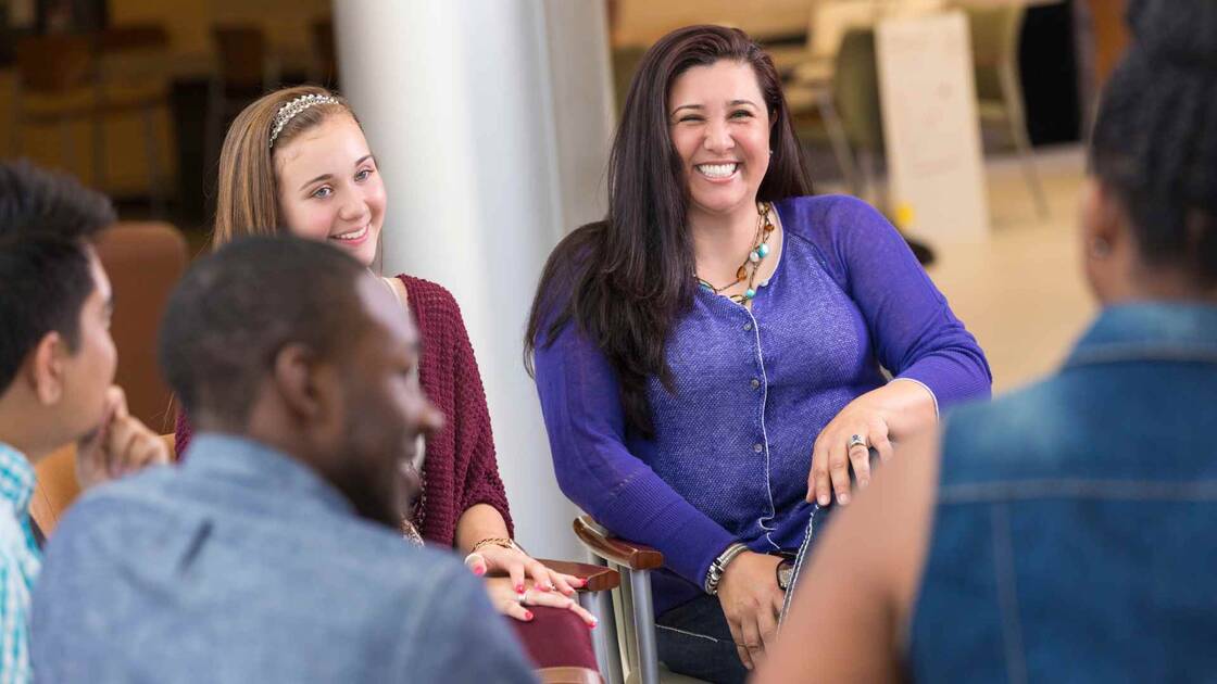 Smiling members of support group meeting