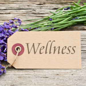 "Wellness" written on tag attached to flowers