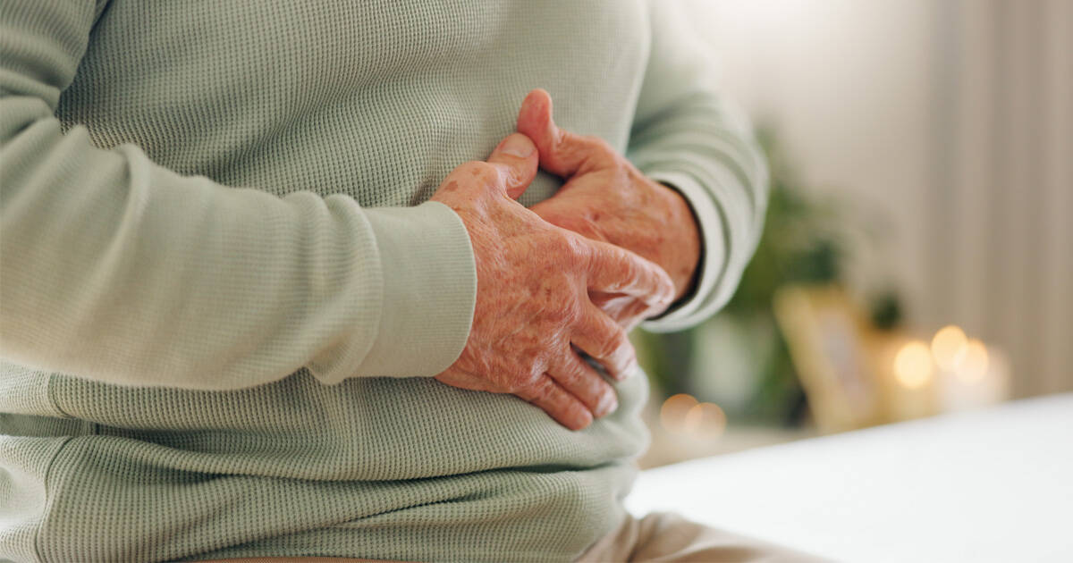 Man holding stomach