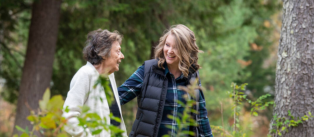 dartmouth health home care nurse with walking with patient outside