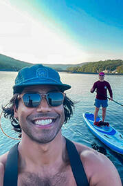 Urology Team members paddle boarding