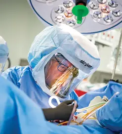 A surgeon working in operating room
