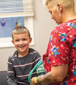 A child being treated by a nurse