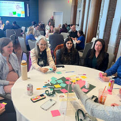 Attendees of the 2026 Dartmouth Rural Health Symposium discuss a topic