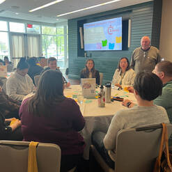 Attendees of the 2026 Dartmouth Rural Health Symposium discuss a topic