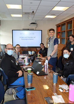 Dermatology Residents at a Presentation