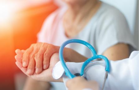 Doctor holding a patient's hand