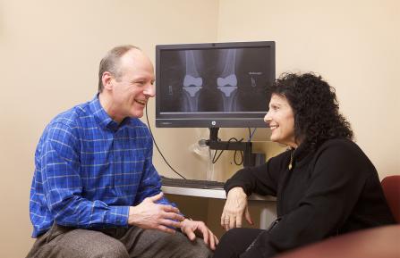 Dr. Houde talking with a patient