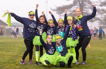 Girls on the run celebrating