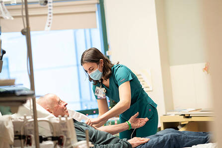 A nurse tending a patient