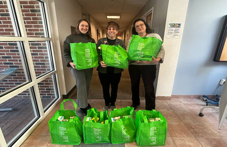 From left, Dartmouth Cancer Center Bennington administrative director Caryn Packard, nutritionist Kristin Irace, RD, LDN and oncology social worker Elizabeth Fredland, LICSW, with patient food bags from Healing Harvest.