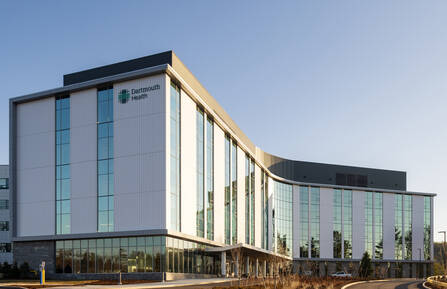 An exterior shot of a building that says 'Dartmouth Health' on the side.