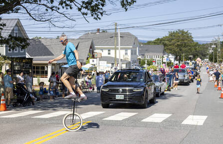 A photo of a man on a unicycle at New London Hospital's Hospital Days event