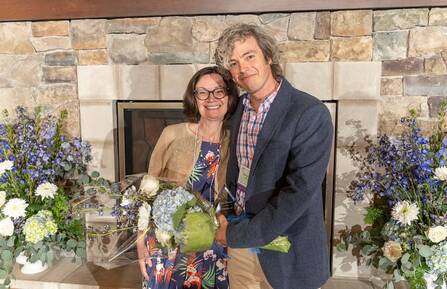 Executive Director of NAMI NH, Susan Stearns, stands with award-winner Patrick Hattan, MD