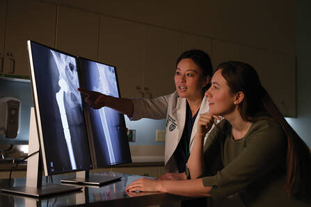 Dr. Stella Lee examining an x-ray