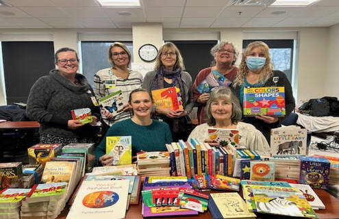 Nurses gathered with books