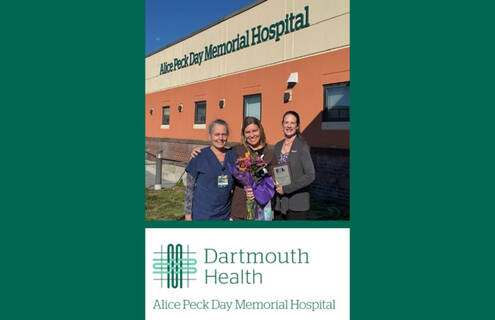 Laura J. Williams, MEd, RN, CEN, center, stands with Brigitte E. Eastman, BSN, RN, CEN, William’s ED colleague who nominated her, to her right, and Jean A. Proehl, MN, RN, CEN, to her left, who presented Williams' award.