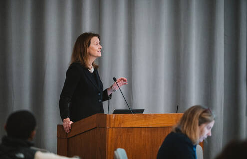Joanne M. Conroy, MD, the CEO and president of Dartmouth Health, stands at a podium