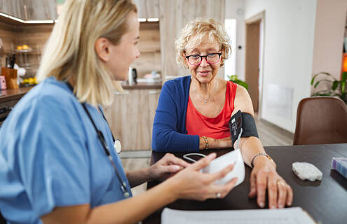 woman getting her blood pressure checked