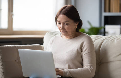 Woman looking at a laptop