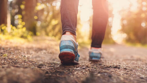 Female walking on trail 