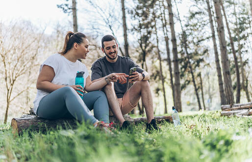 couple sitting outdoors after taking a walk.