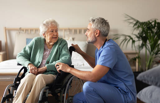 Man talking to an elderly patient