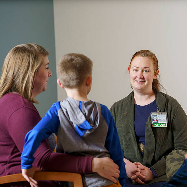 A provider talks to a parent and child