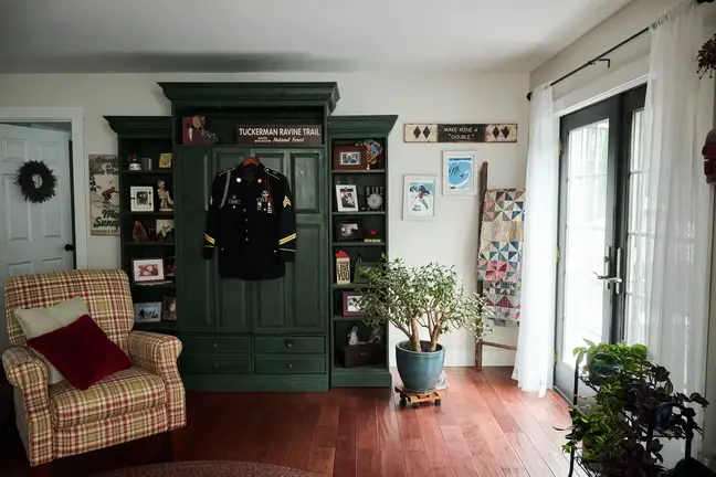 The Clark's living room, shown with Jeff's uniform hanging on the wardrobe
