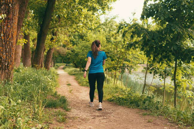 Woman walking in woods