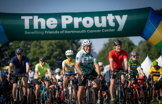 People biking across a finish line