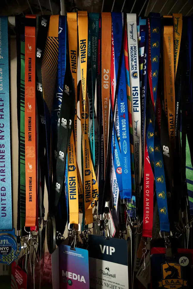 Dozens of colorful lanyards hanging together