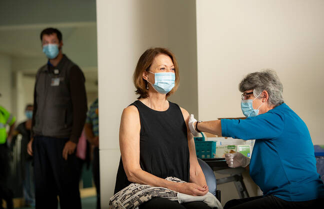 Joanne M. Conroy, MD, getting a flu shot