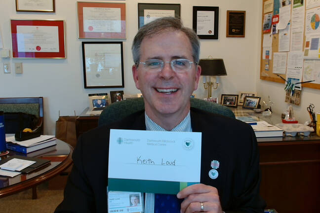 Keith Loud proudly displaying his Honor a Caregiver nomination