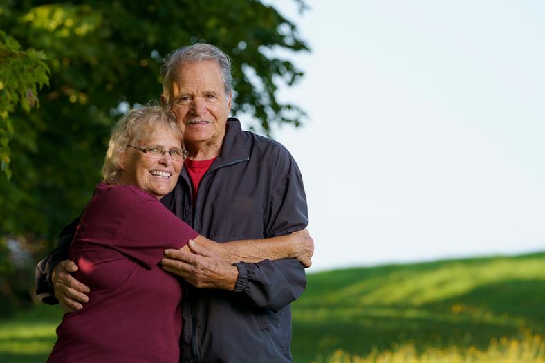Senior Couple standing in a Field