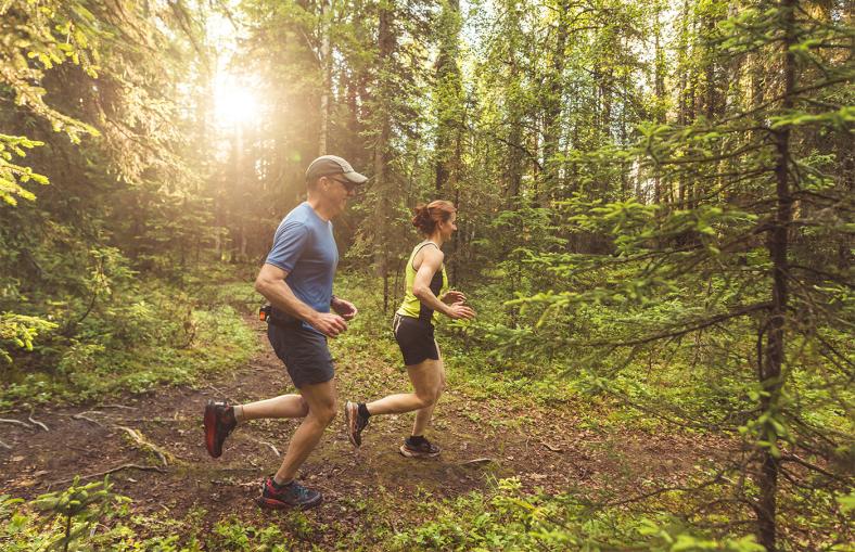 People running in the woods