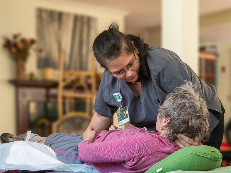 VNH personal care assistant caring for long term care patient