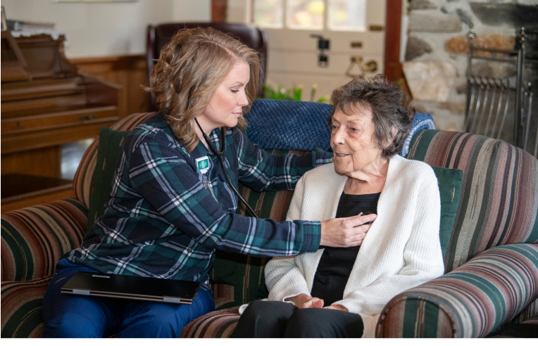 VNH nurse listening to patients heart sounds in patients home